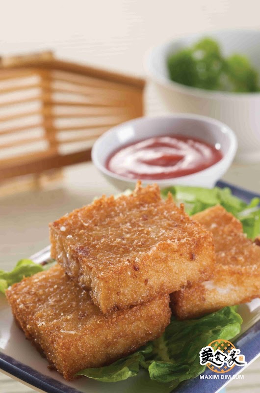 Crispy fried turnip cake with chilli dipping sauce, photographed on a wooden tray